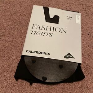 Never worn, semi sheer tights with hearts on them